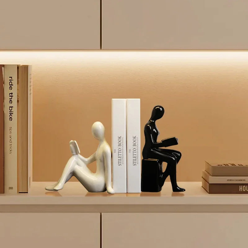 eprolo modern bookends with white and black abstract human figures on a shelf with books