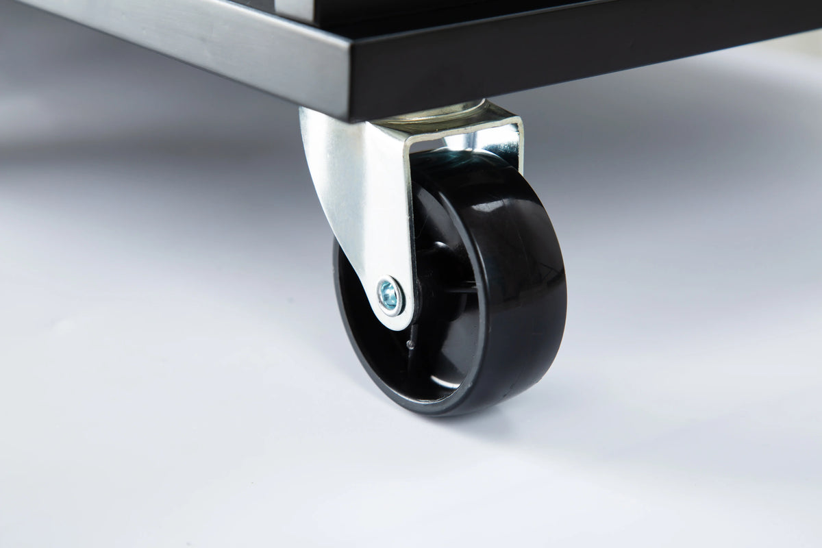 Close-up of a heavy-duty black caster wheel on an eprolo mobile kitchen island.