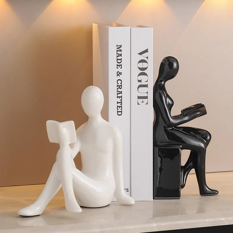 Modern eprolo black and white character bookends holding Vogue books for living room decor