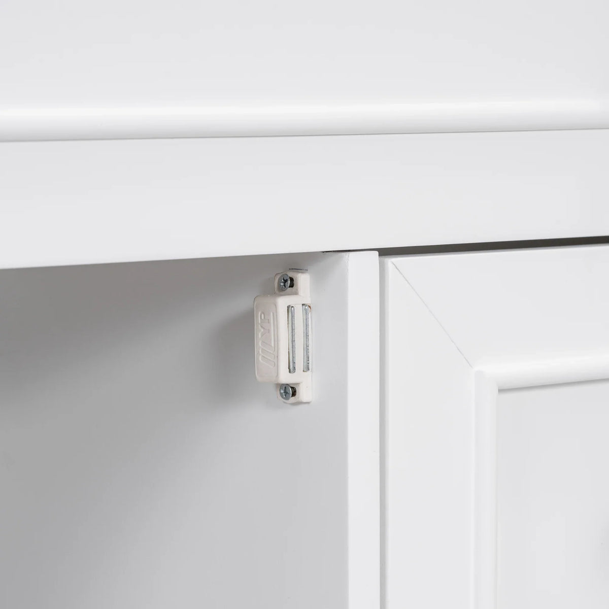 Close-up of a white cabinet hinge on an eprolo bathroom vanity cabinet.