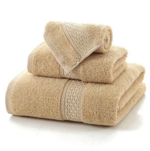 Set of three beige eprolo 100% cotton terry bath towels in varying sizes.