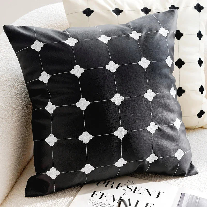 Black leather sofa pillow cover with white quatrefoil embroidery by eprolo