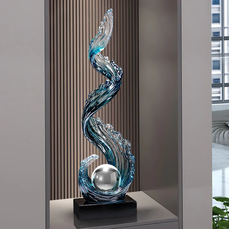Modern blue wave glass sculpture with a silver sphere on a black base for living room decor