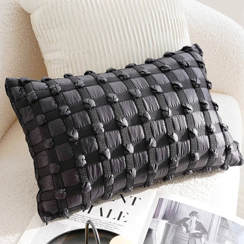 Eprolo charcoal grey textured decorative pillow cover on a white sofa