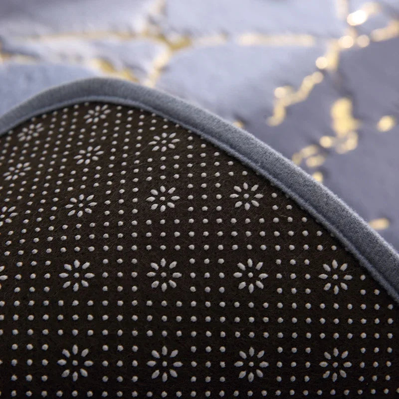 Close-up of a dark brown eprolo non-slip absorbent floor mat with white polka dot pattern.