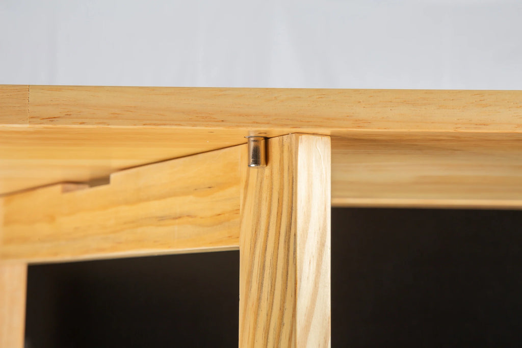 Close-up of the wooden joint and hardware of an eprolo rubber wood kitchen island countertop.