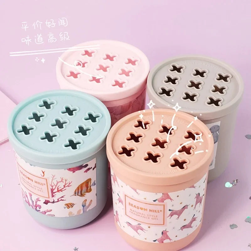 Set of four eprolo car balm solid perfume air fresheners in pastel colors with decorative lids.