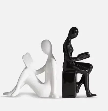 Modern eprolo character bookends featuring black and white minimalist human figures.