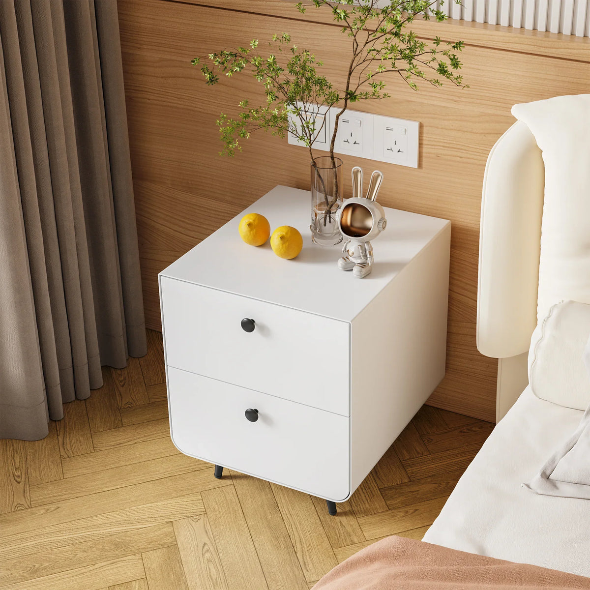 Modern white eprolo night stand storage cabinet with two drawers in a bedroom setting.