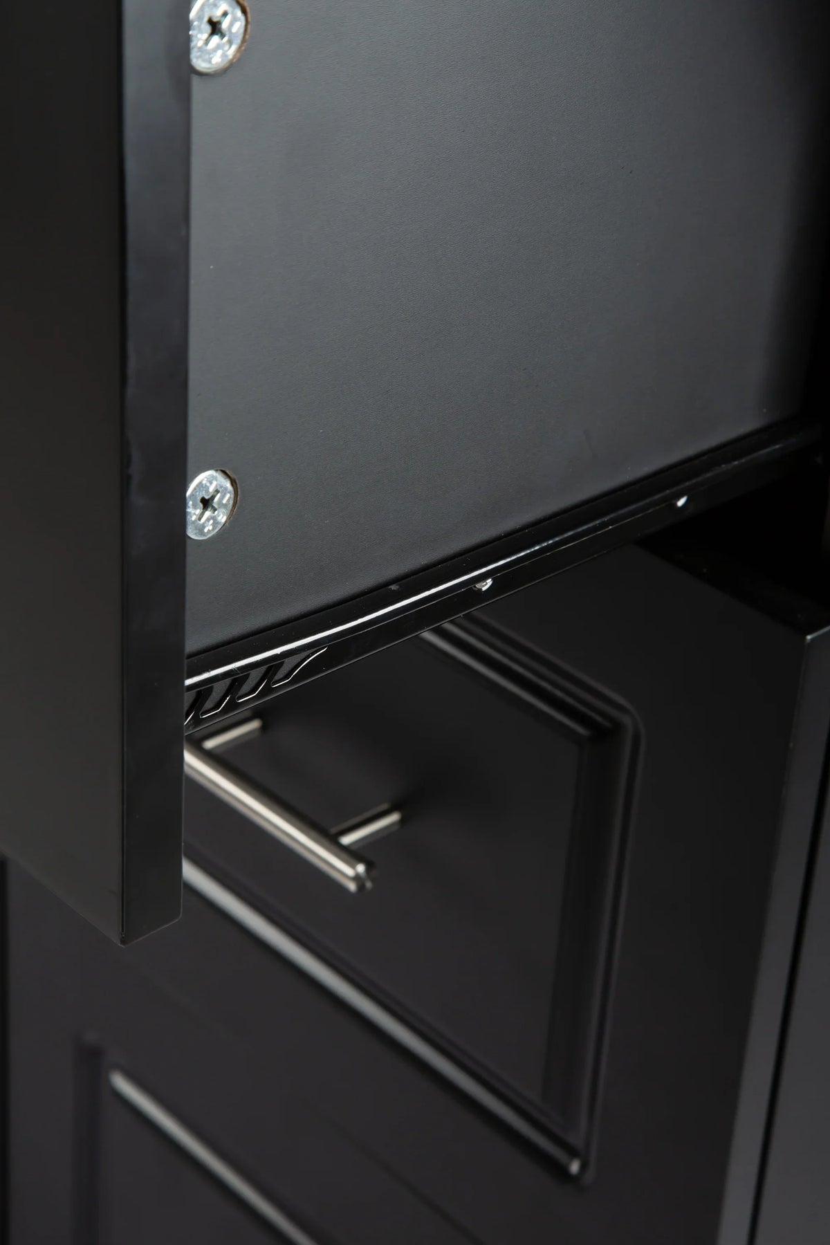 Close-up of the black metal frame and screw details on an eprolo mobile kitchen island.