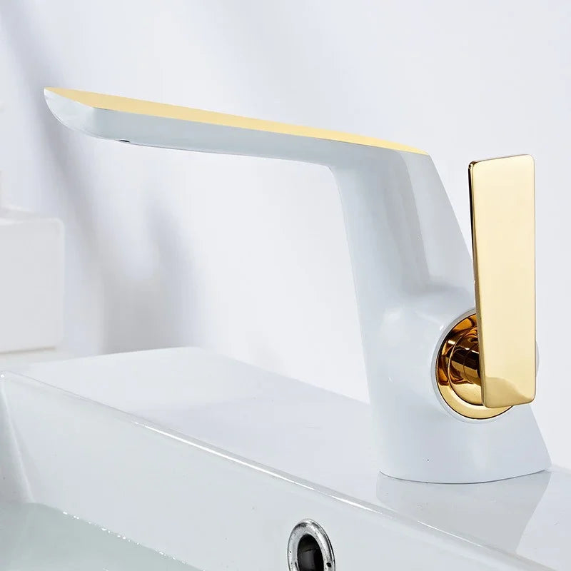 Modern white and gold eprolo bathroom faucet on a white ceramic washbasin