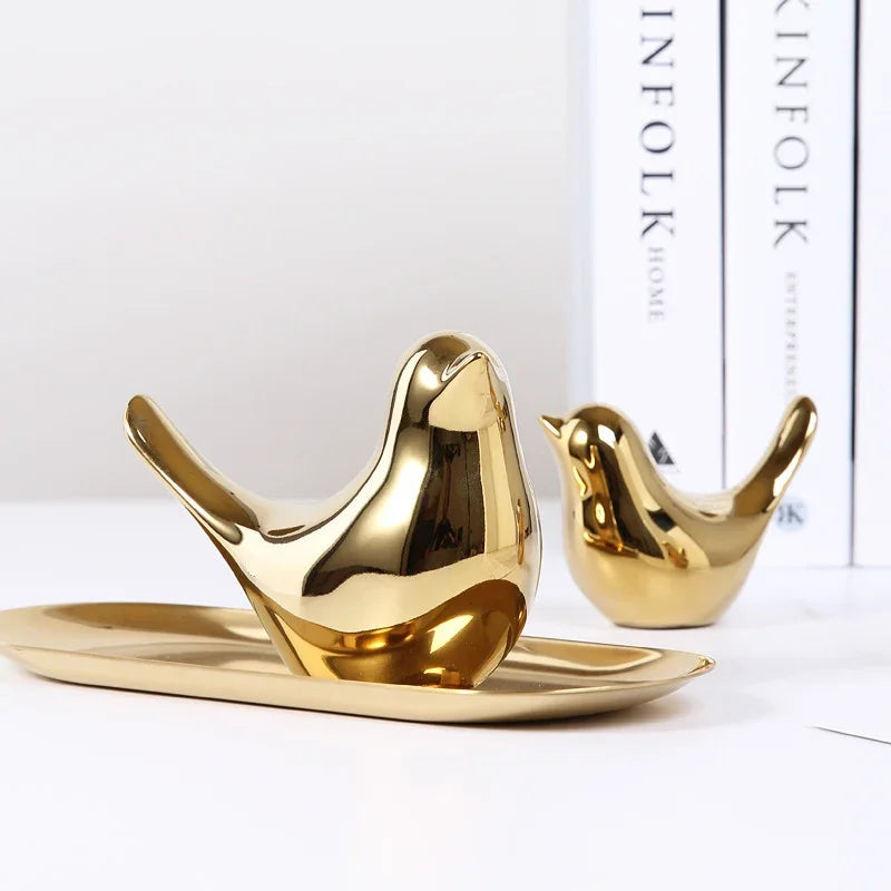 Two Nordic creative golden ceramic bird ornaments by eprolo on a matching gold tray.