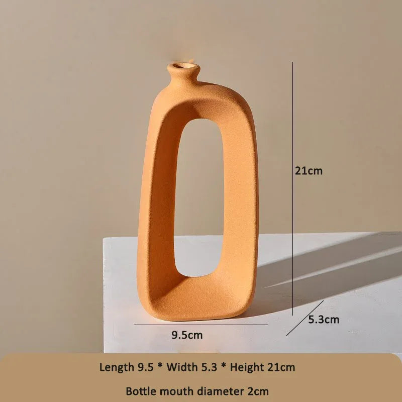 Modern orange eprolo ceramic vase with a hollow oval design and dimensions listed.