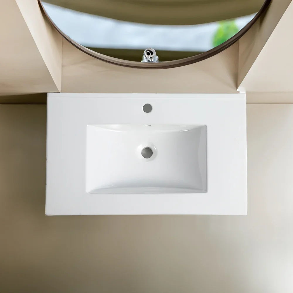 Top view of an eprolo 30 inch white ceramic bathroom sink basin under a round mirror.