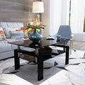 Modern eprolo rectangle black glass coffee table in a bright living room setting.