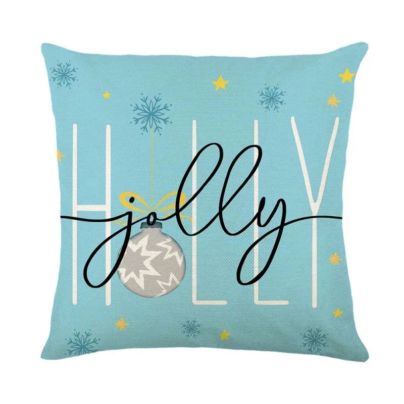 Light blue Christmas pillow cover with 'Holly Jolly' script and snowflake pattern