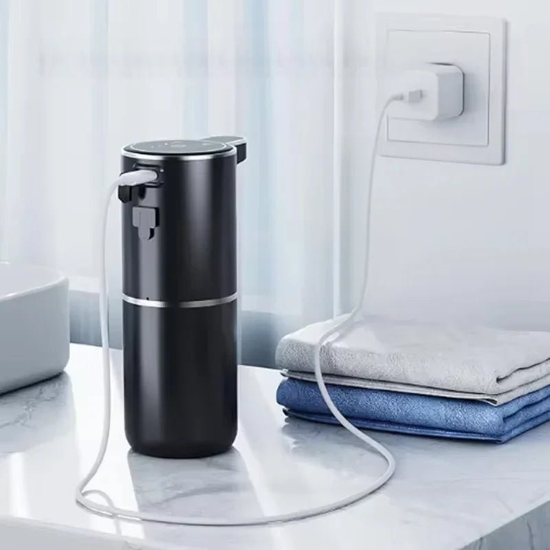Eprolo touchless sensor soap dispenser in a bathroom setting with towels.