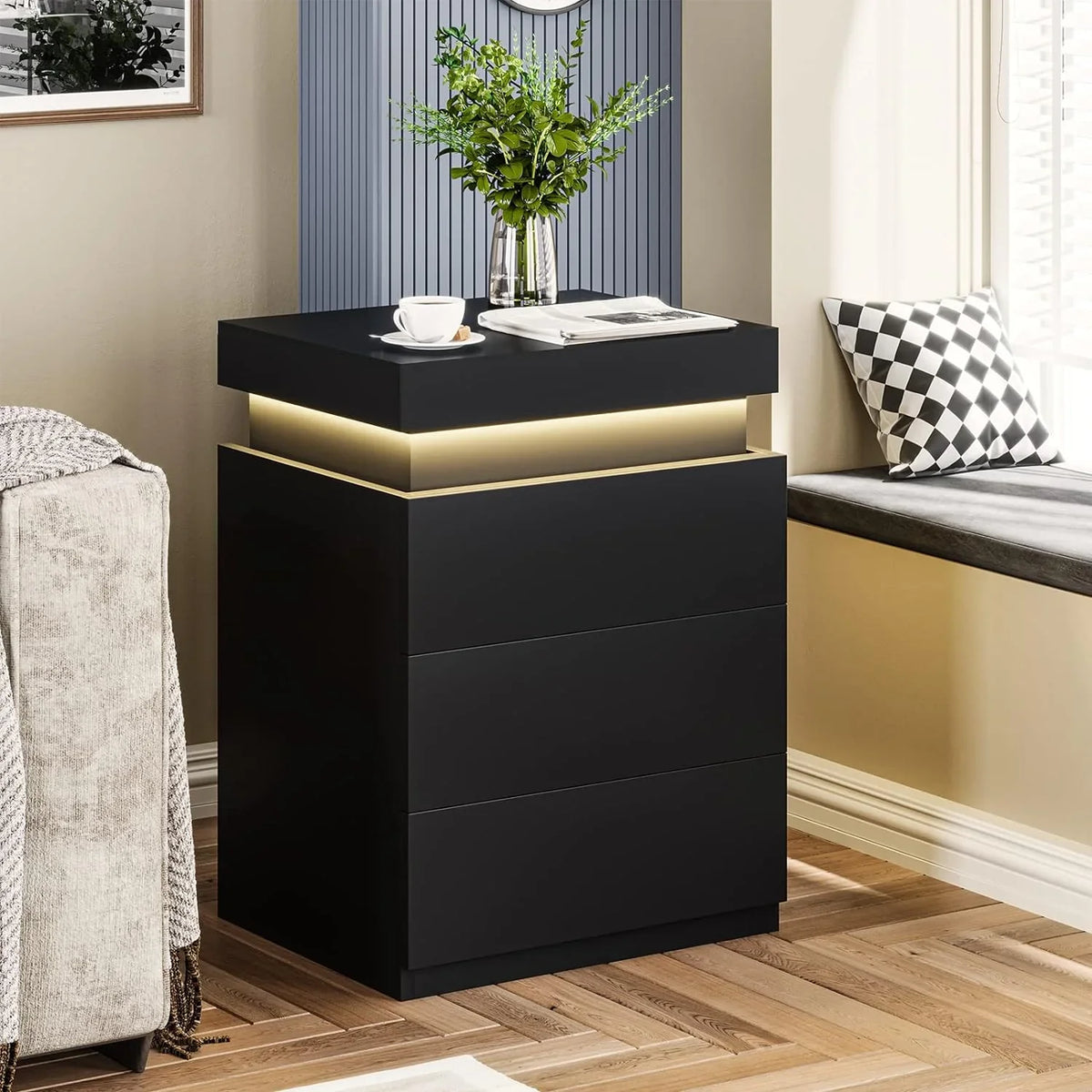Modern black LED nightstand with multi-colour ambient lighting in a contemporary bedroom.