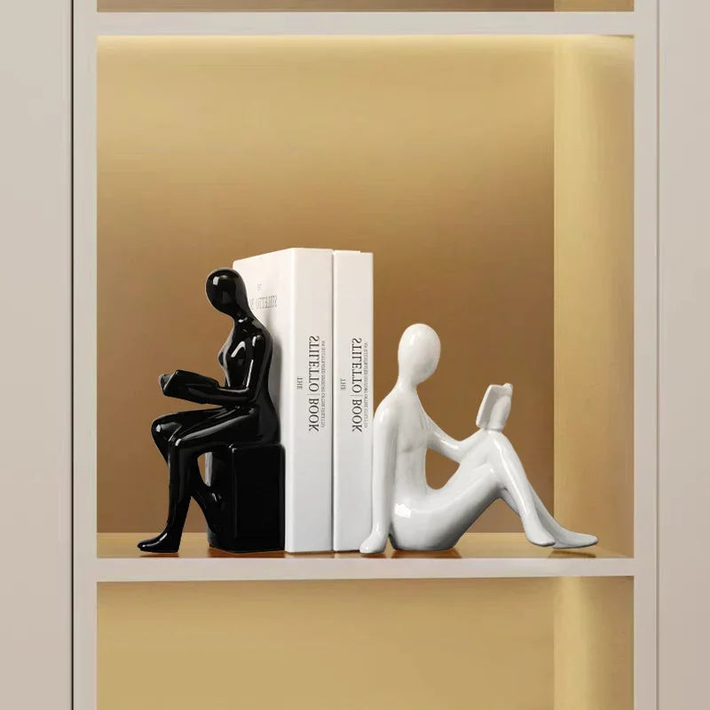 Modern eprolo black and white character bookends holding books on a shelf