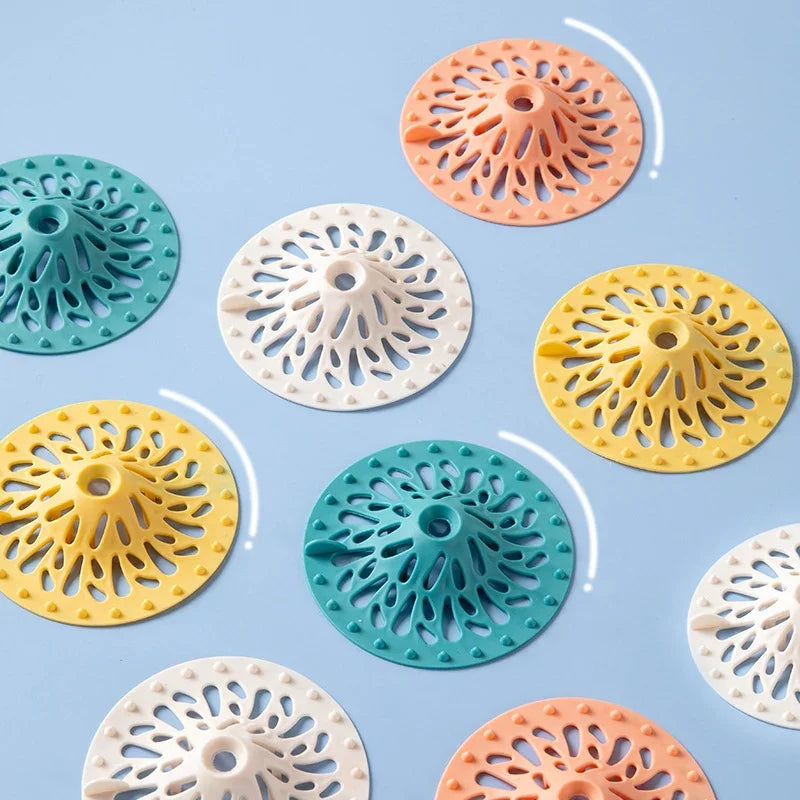 Colorful volcano-shaped silicone hair and debris drain filters for bathroom and kitchen sinks.