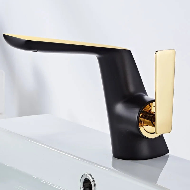 Modern matte black and gold eprolo bathroom basin faucet on a white sink