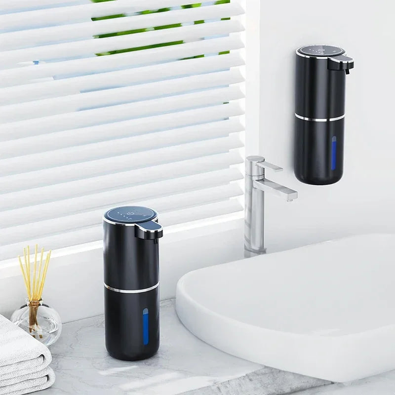 Two eprolo black touchless sensor soap dispensers on a bathroom marble countertop.