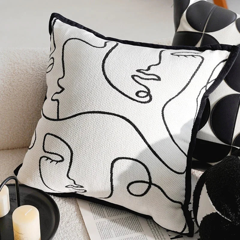 White eprolo sofa pillow cover with black minimalist line art face design