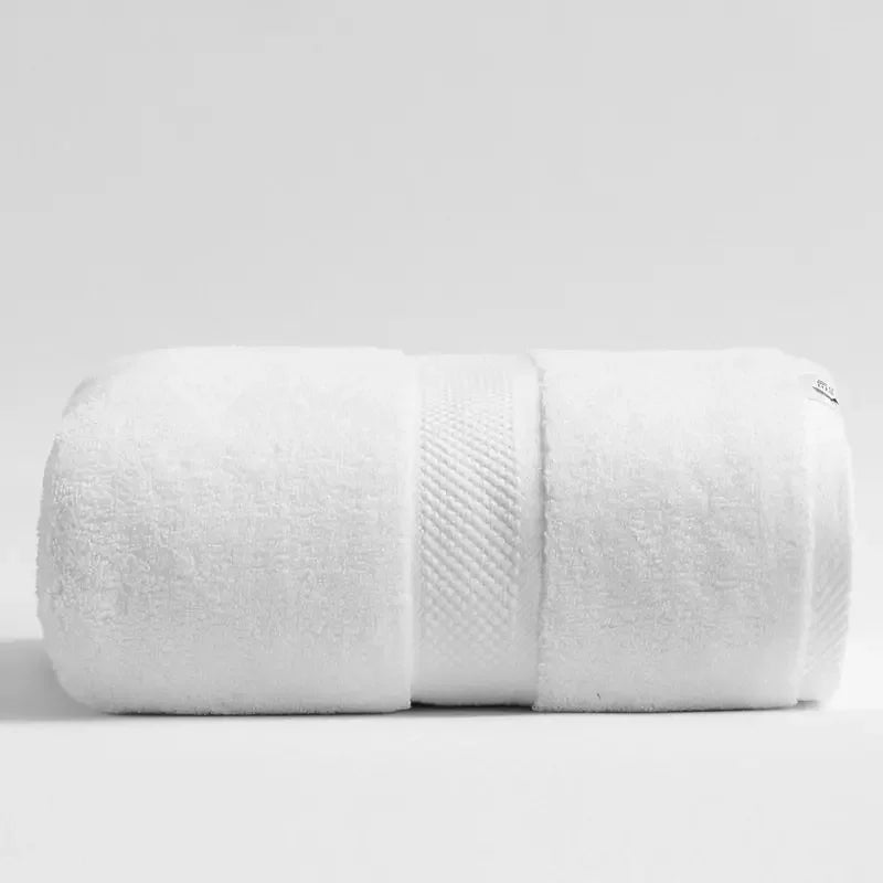 Rolled up white eprolo luxury 100% cotton extra large bath towel for bathroom or sauna