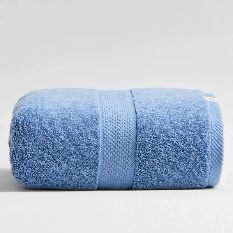Folded blue 100% cotton luxury bath towel by eprolo