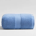 Folded blue 100% cotton luxury bath towel by eprolo